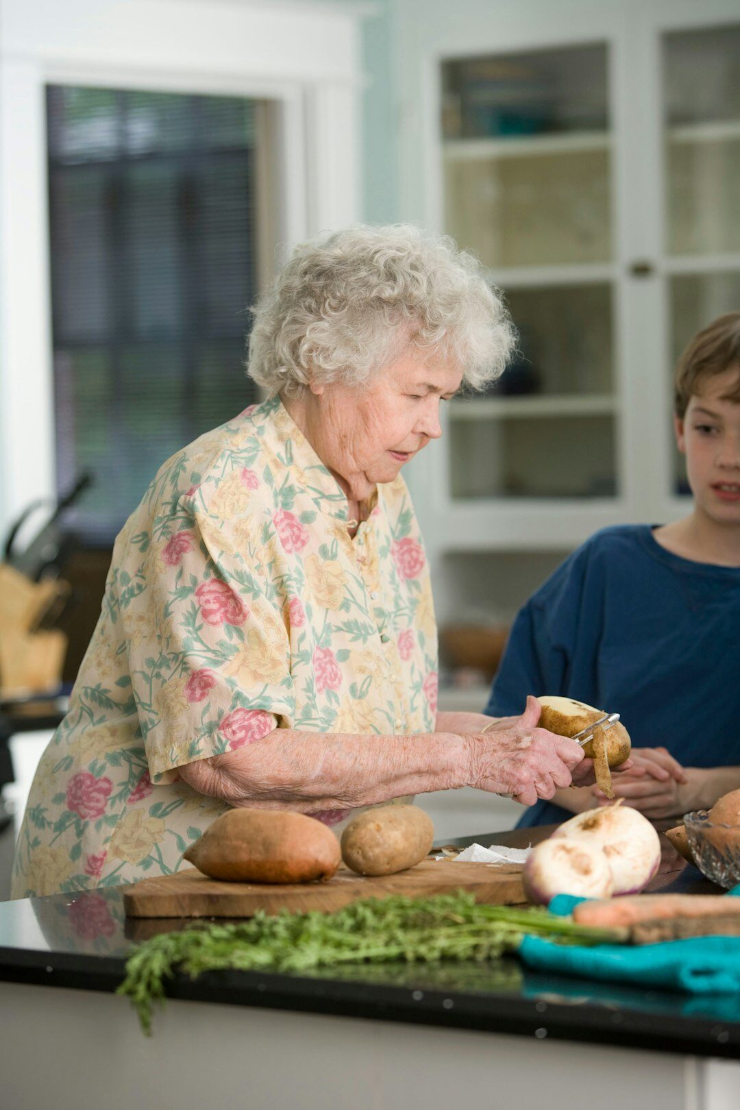 Seniors cooking together in a community kitchen