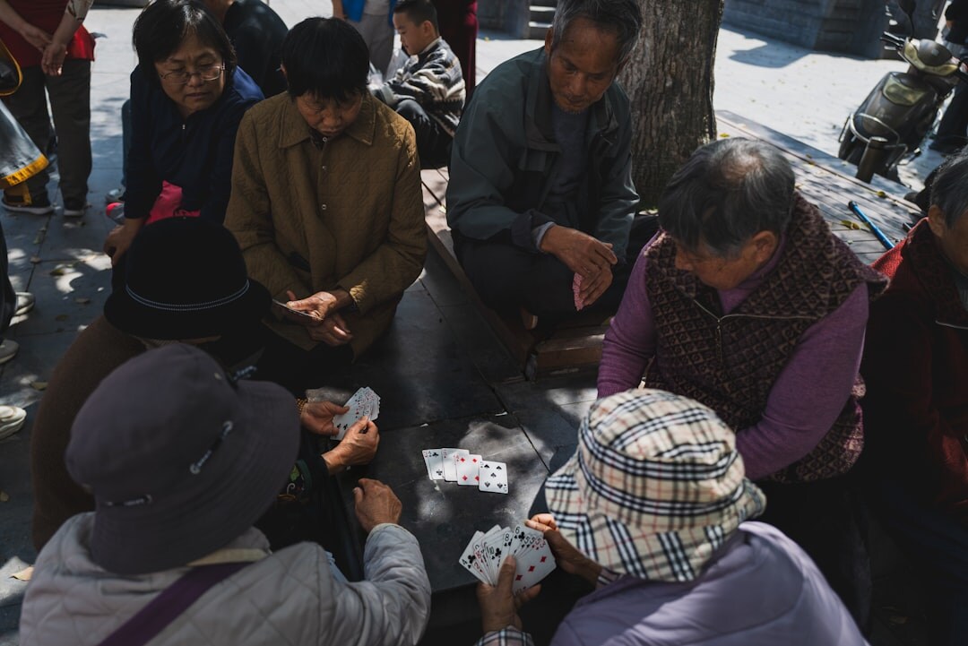 group of seniors playing cards
