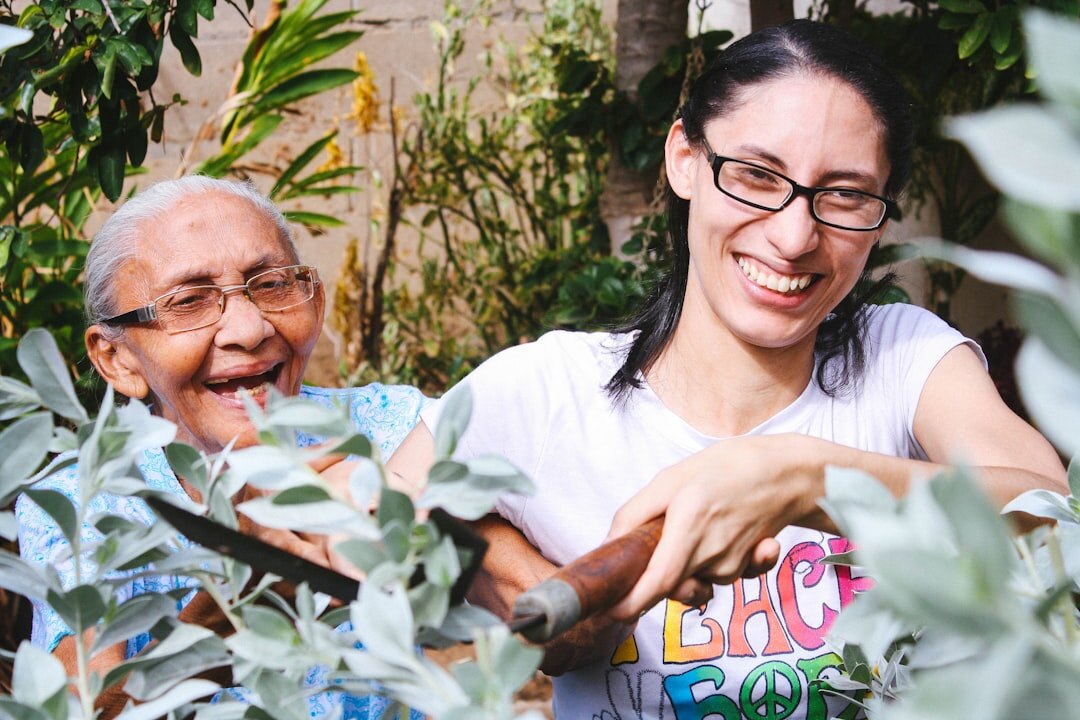 Young volunteer helping an elderly woman